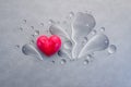 Red heart with water splash and water drop