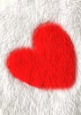 Red heart on white blanket material Royalty Free Stock Photo