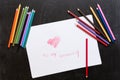 Red heart on white paper drawn by pencil on black background. Pencils around. Love Mother`s day concept. To my mummy Royalty Free Stock Photo