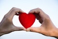 Red heart in woman and man hands, hands holding a soft heart shape, Couple love, Valentine`s Day Royalty Free Stock Photo
