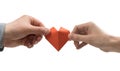 Red heart in woman and man hands. Image on isolated white background. Royalty Free Stock Photo