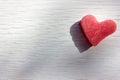 Red heart on wooden table. Heart-shaped slice of watermelon on white background. Royalty Free Stock Photo