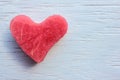 Red heart on wooden table. Heart-shaped slice of watermelon on white background. Royalty Free Stock Photo