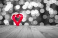 Red Heart on wooden table, on a whiteblack background .Valentine`s day theme . High resolution photo. Royalty Free Stock Photo