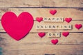 Red heart with wooden text Happy Valentine Day on wood table background. Royalty Free Stock Photo