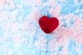 Red heart with wounds on pink-blue ice. Anti Valentine. Shows pain, fire, broken feelings Royalty Free Stock Photo