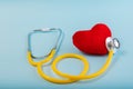 Red heart, Yellow Stethoscope on blue background with Copy space. Medical concept, Health care concept Royalty Free Stock Photo