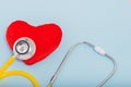 Red heart, Yellow Stethoscope on blue background with Copy space. Medical concept, Health care concept Royalty Free Stock Photo