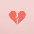 Red heartbreak / broken heart on pink background