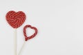 Red hearts as lollipop candy. Valentines day minimalist background. red heart, love symbol, space for text concept Royalty Free Stock Photo