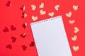 Red hearts on red background with empty white notepad Royalty Free Stock Photo