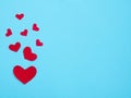 Red hearts on a blue background.