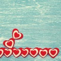 Red hearts on a blue wooden background Royalty Free Stock Photo