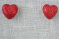 Red Hearts on Burlap Background