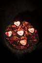 Red hearts and candles on wooden background Royalty Free Stock Photo