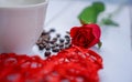 Red hearts and flowers on a white wood floor with space, ideas love or the day of love Valentines Day Royalty Free Stock Photo