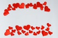 Red hearts frame a white sheet. Free space for recording Valentines Day greetings and love confessions