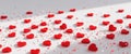 Red Hearts and Glitter with a Bright Empty Background Royalty Free Stock Photo