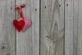 Red hearts hanging on wood background