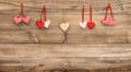 Red hearts hanging on wooden background. Valentines Day Royalty Free Stock Photo