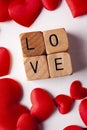 Red hearts and love letters on wooden dice Royalty Free Stock Photo