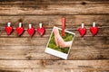 Red hearts and photo as two hands hold each other. Valentines Day card Royalty Free Stock Photo