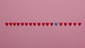 Red Hearts In A Row On Pink Background. Valentines Day Love Decor Background Concept