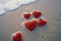 Red hearts on the sandy beach, love valentines day. Generative AI Royalty Free Stock Photo