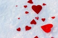 Red hearts on snow