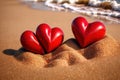 Red hearts together on the beach, showing holiday summer romance