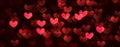 Red hearts valentine day defocused bokeh lights on a black background Royalty Free Stock Photo