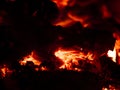 Red heat of charcoal burning wood in the dark Royalty Free Stock Photo