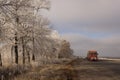 Red heavy vehicles on the winter road