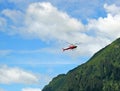 Red helicopter on a rescue mission Royalty Free Stock Photo