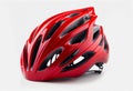 red helmet of a cyclist on a white background. Royalty Free Stock Photo