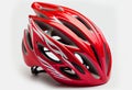 red helmet of a cyclist on a white background. Royalty Free Stock Photo