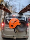 A red helmet hangs as a warning sign on an oversized cargo on a car.