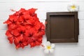 red Hibiscus flowers on white wood table background with space f Royalty Free Stock Photo