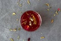 Red hibiscus tea in a glass cup