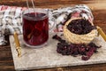 Red hibiscus tea in glass cup on white wooden table with dry rose petals. Hibiscus tea background Royalty Free Stock Photo