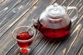 Hibiscus tea in glass teapot and cup Royalty Free Stock Photo