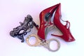 Red High Heels Black Mask Handcuffs Royalty Free Stock Photo