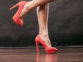 Red high heels spiked shoes on female legs Royalty Free Stock Photo