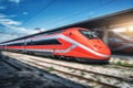 Red high speed train in motion on the railway station Royalty Free Stock Photo