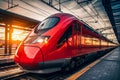 Red high speed train in motion on the railway station at sunset Royalty Free Stock Photo