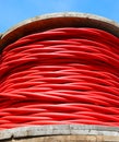 red high voltage electrical cable reel for transporting electricity from power plant Royalty Free Stock Photo