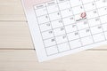 Red highlighter with ovulation day mark on calendar