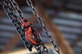 Red hoist and chain on background