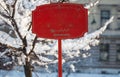 Red holiday Christmas wooden sign mockup empty placeholder entrance exit New Year Santa holiday market in the city park during wi