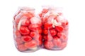 Red homemade tomatoes in jars on a white background Royalty Free Stock Photo